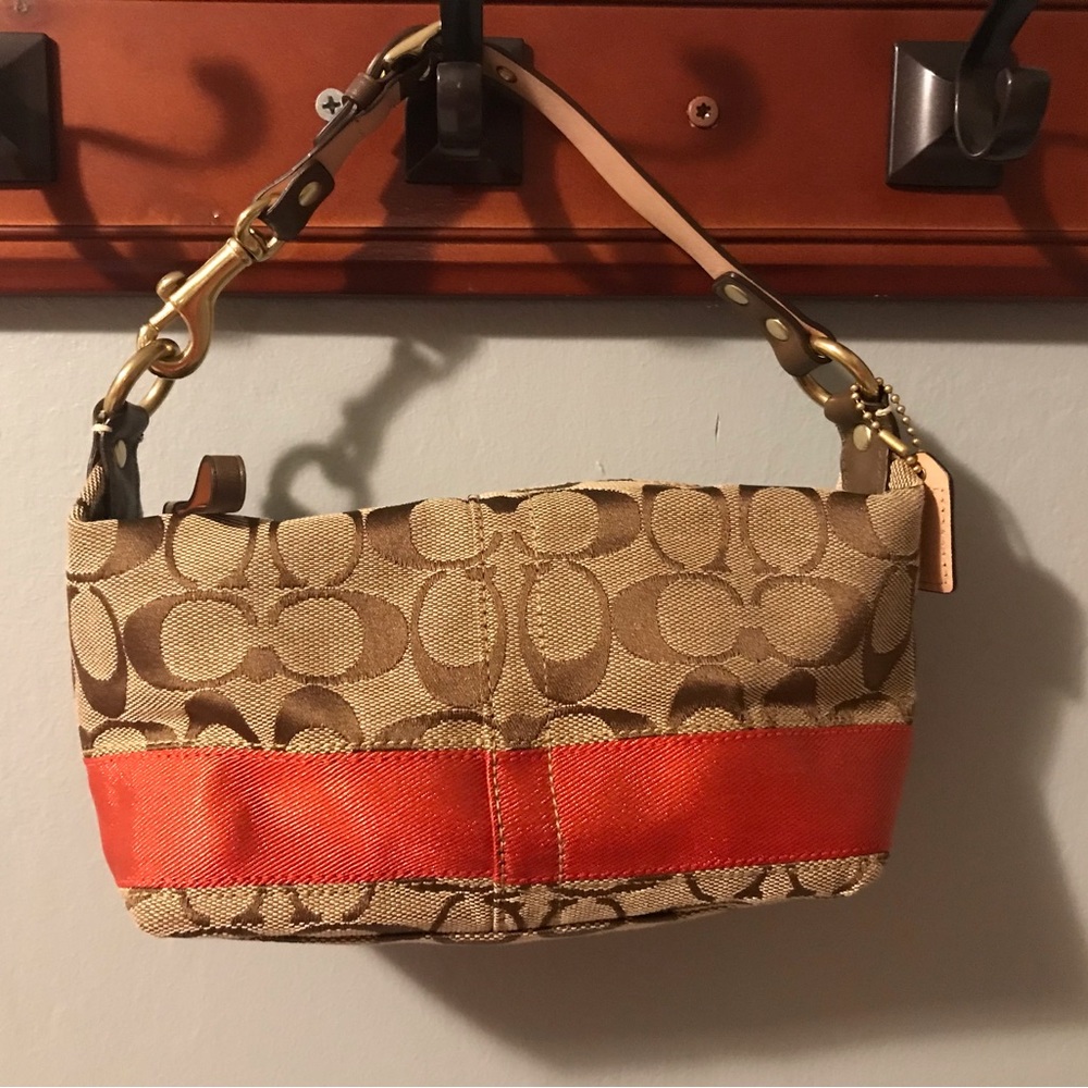 Coach monogram mini banquette with red accent